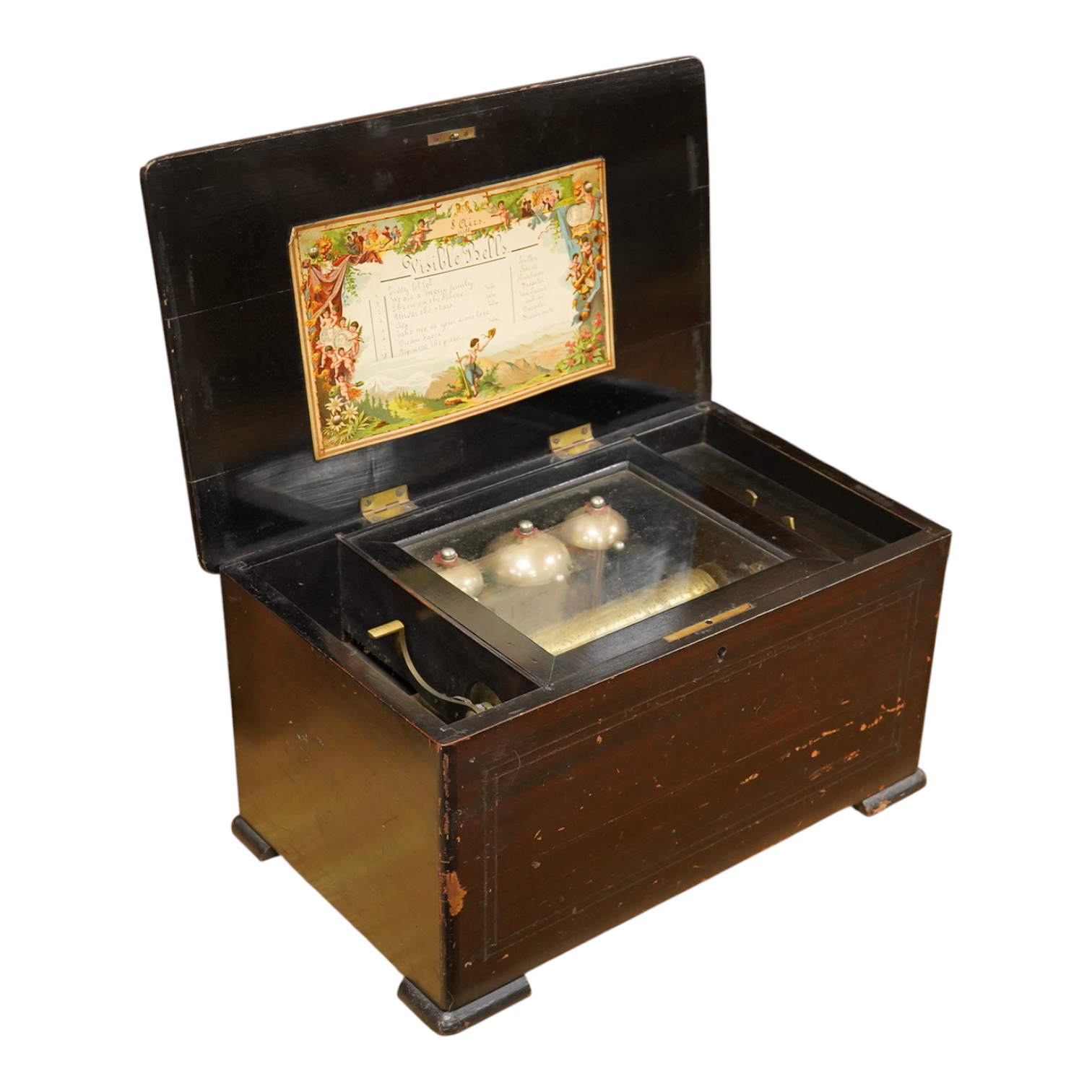 A mid-19th century inlaid and ebonised rosewood Swiss cylinder music box playing eight airs on a cylinder and three bells, card label to the inside of the lid listing the airs, complete with all teeth to the comb, cylind